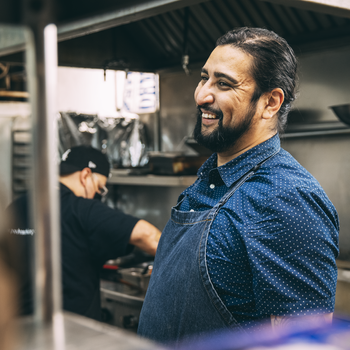 Man standing in restaurant kitchen