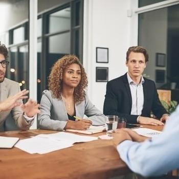 employees interviewing candidate