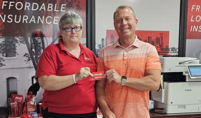 Michigan Gas Giveaway winner Jeff in a Direct Auto store with agent