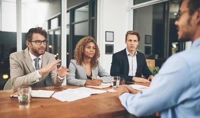 employees interviewing candidate