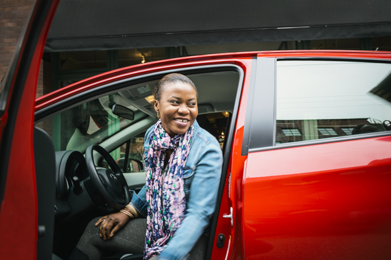 woman smiling inside of car 
