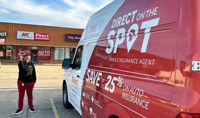 Direct on the spot van in front of a Direct Auto store in Louisiana with Janay Martin