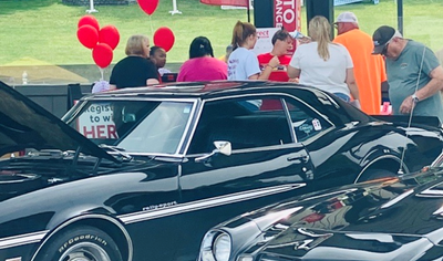 Two beautiful classic cars at the GLTC Car & Bike Show
