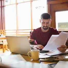 business owner reviews bills