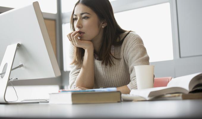 Young woman sitting in front of computer.