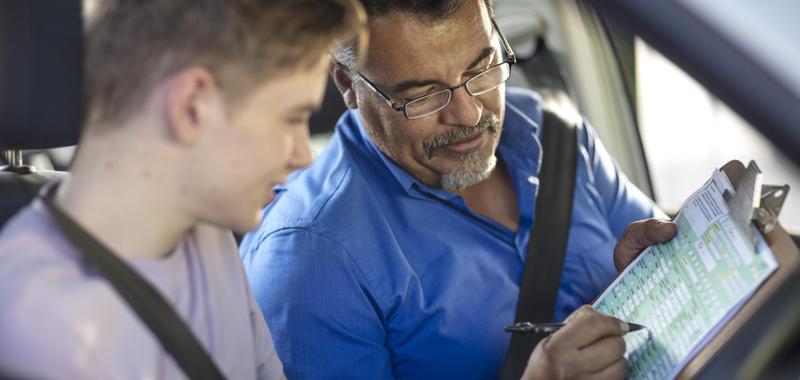 driving instruction going over review of student's driving skills 