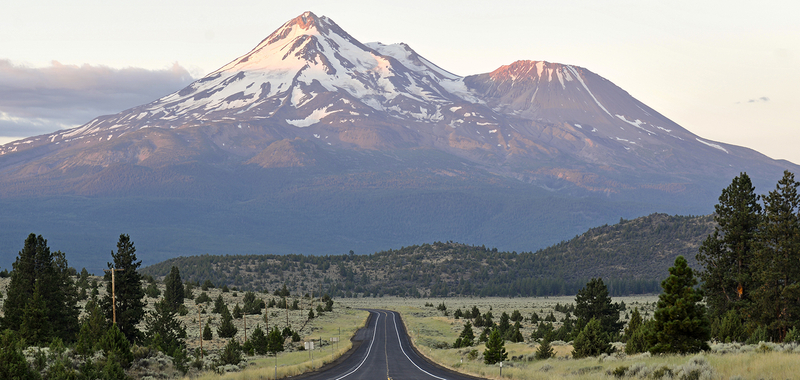 Open road headed towards the mountains