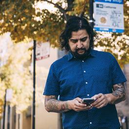 guy walking with device