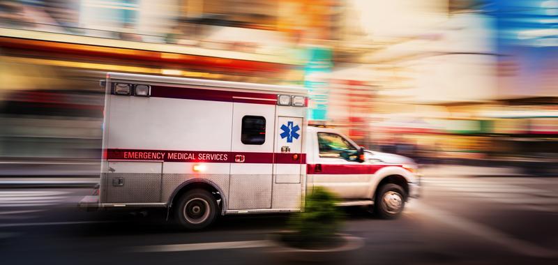 ambulance driving through city 