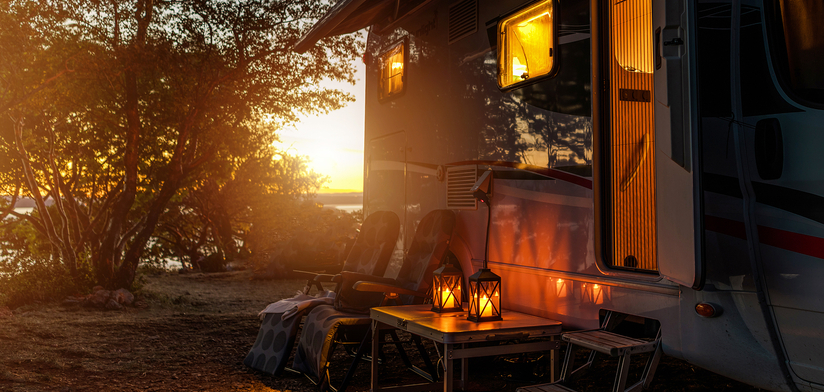 RV camper van camping at sunset