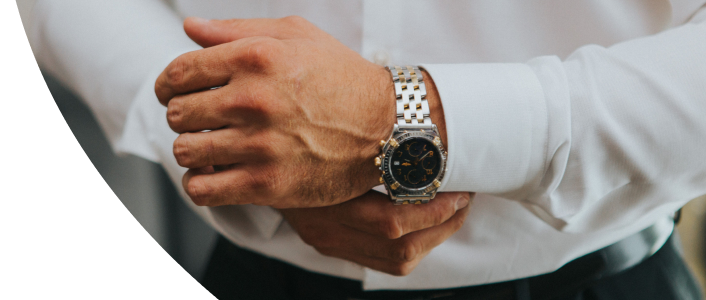 Well dressed man buttoning his cuff - sleeve