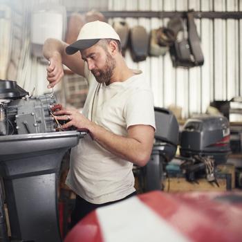 Man fixing boat motor_Getty.jpg