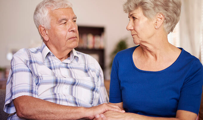 mature couple holding hands