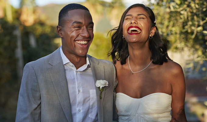 Wedding day couple laughing together