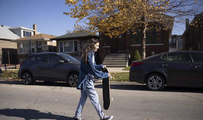 Girl holding skateboard