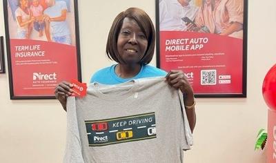 Texas Gas Giveaway winner with Direct Auto T-shirt Keep Driving 