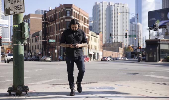 Guy walking with phone