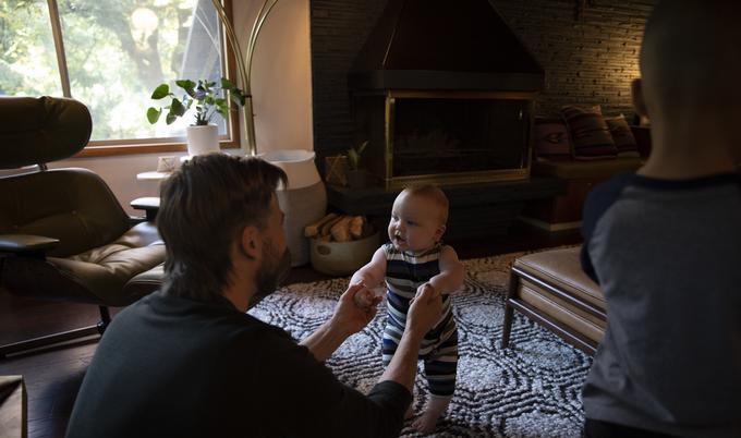 man playing with baby
