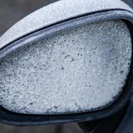 Frost on car's side mirror.
