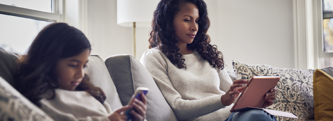 Mom and daughter on tablet and phone