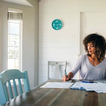 Woman doing finances at home.