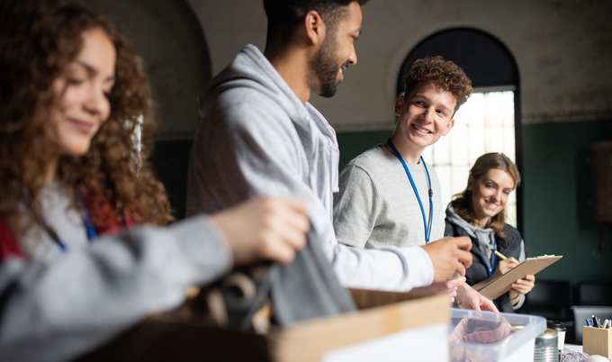 A group of volunteers working in a charity donation center