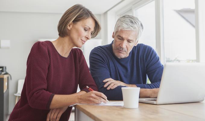 Man and woman looking at paperwork.  