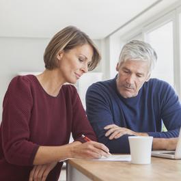 Man and woman looking at paperwork.  