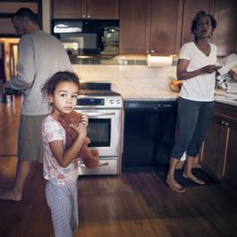 Girl with teddy bear and parents