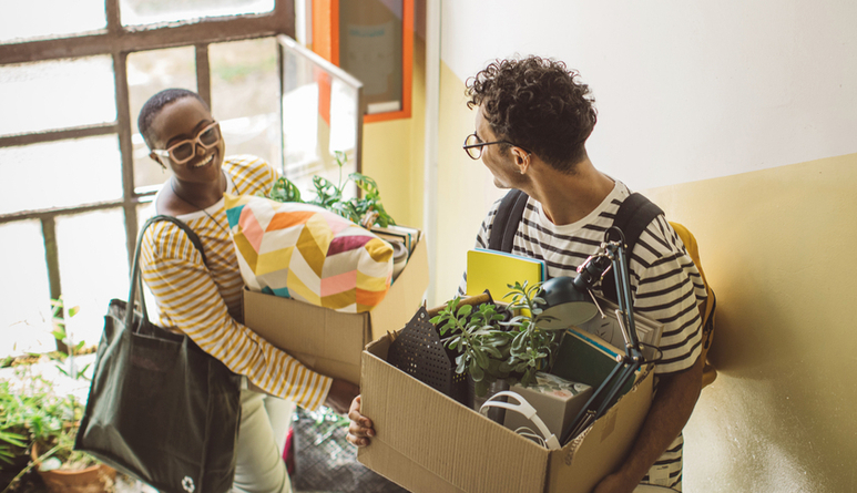 College students moving in dorm.