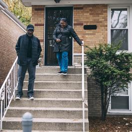 family walking down stoop