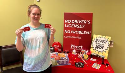 Alabama Gas Giveaway winner at a Direct Auto store 