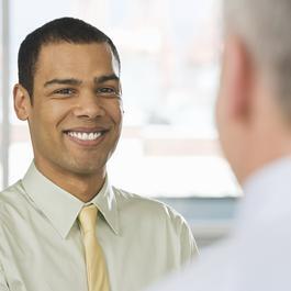 Two men talking to each other.