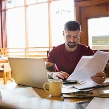 business owner reviews bills