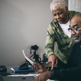 Man and woman looking at papers