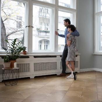 woman and man looking out window