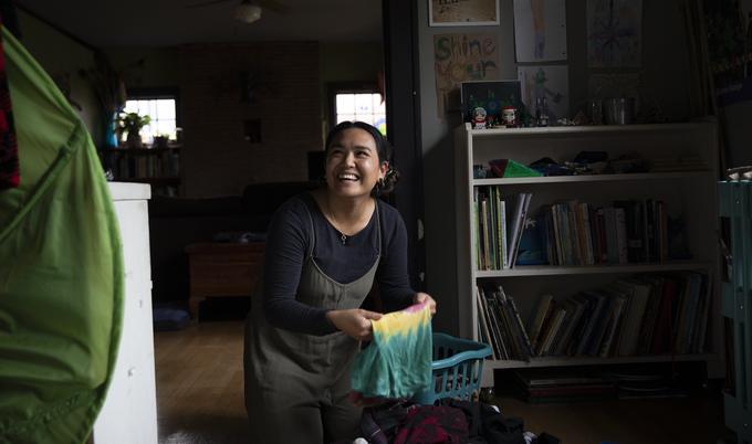 laughing woman doing laundry