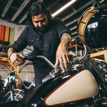 guy fixing bikes