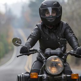 Motorcyclist dressed in protective gear. 