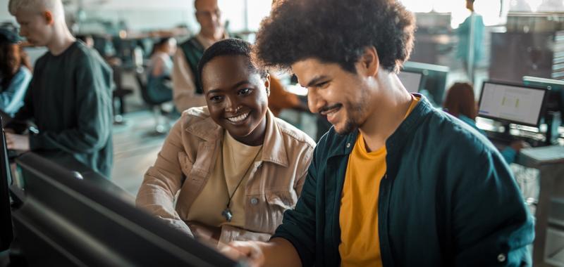 two people looking at the computer 