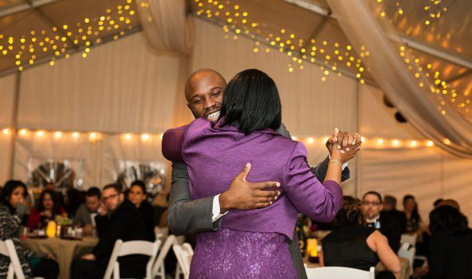 Groom dancing with mom at wedding