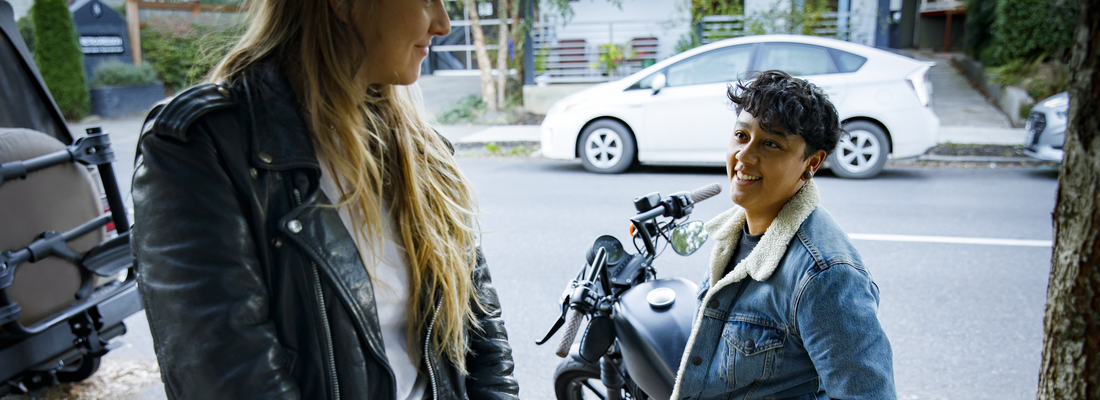 Couple standing next to bike