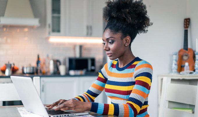 woman with laptop in kitchen