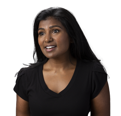 photo of an Indian disabled young woman wearing a black shirt and using her canes