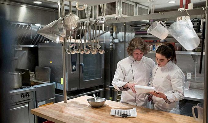 two chefs in kitchen