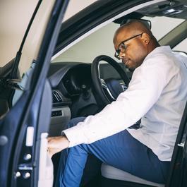 Man getting into car