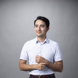 young hispanic man business casual portrait