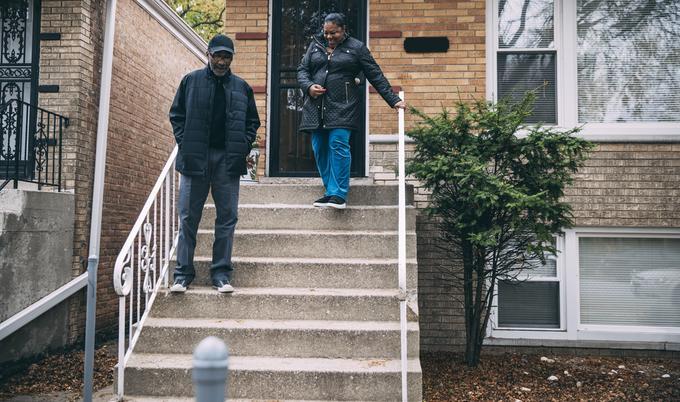 family walking down stoop