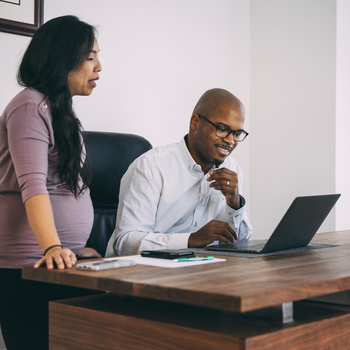 Man and woman in office.