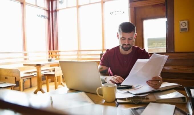 business owner reviews bills